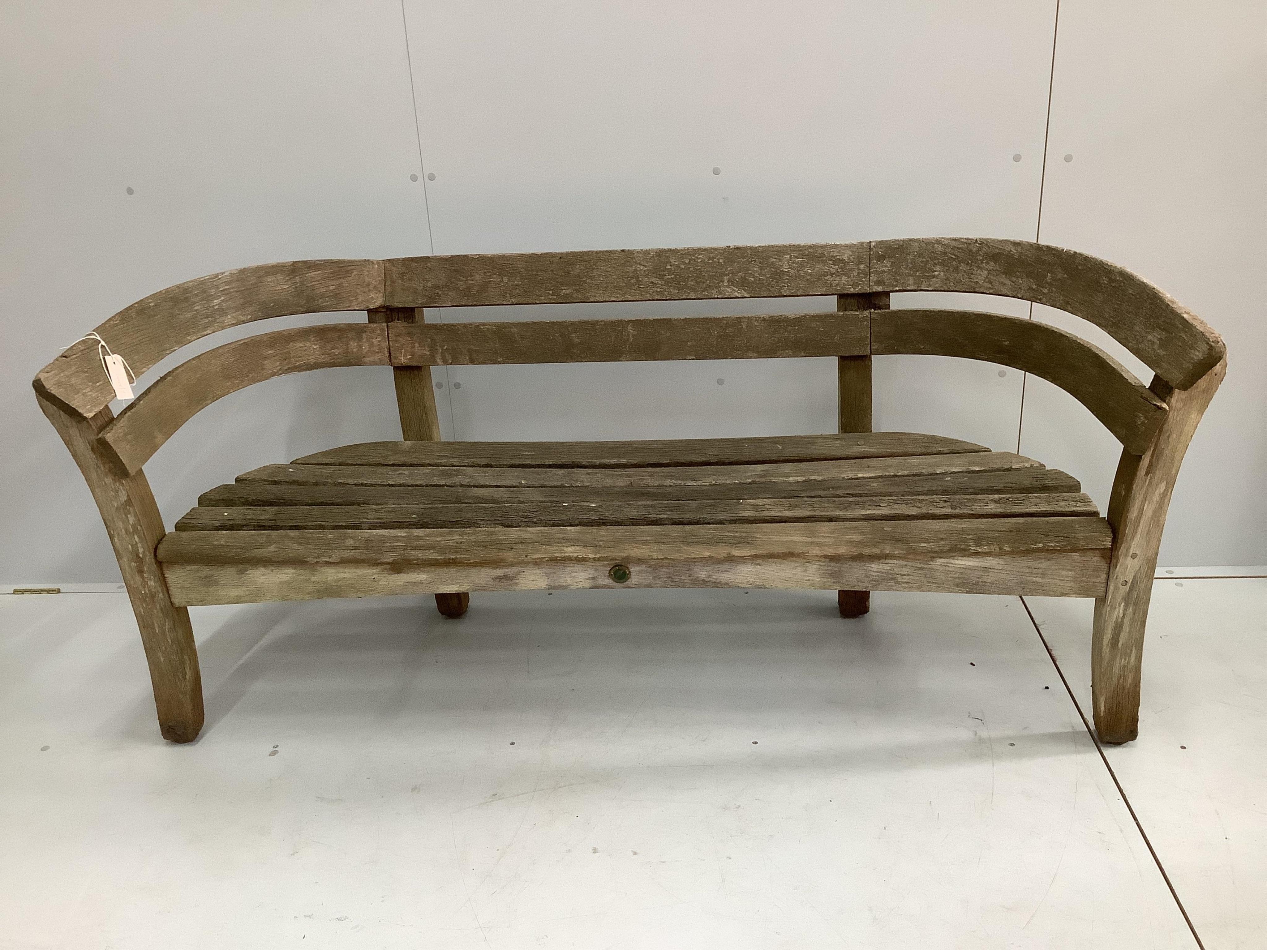 A Gaze Burvill steam bent oak “Court” garden bench seat, width 170cm, depth 51cm, height 80cm. Condition - fair